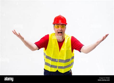 Confused Factory Worker Expressing Anger Looking Up In His Boss With