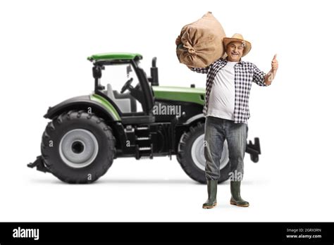 Full Length Portrait Of A Happy Mature Farmer Gesturing Thumbs Up In