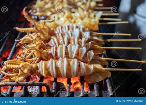 Grilled Squid In A Stick At The Street Food In China Town Thailand