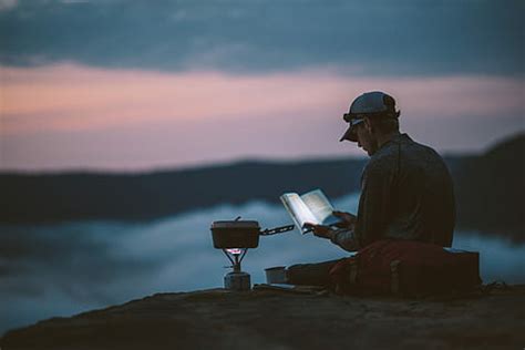 HD wallpaper: Man reading a book in the ocean at night, people, books, coast | Wallpaper Flare