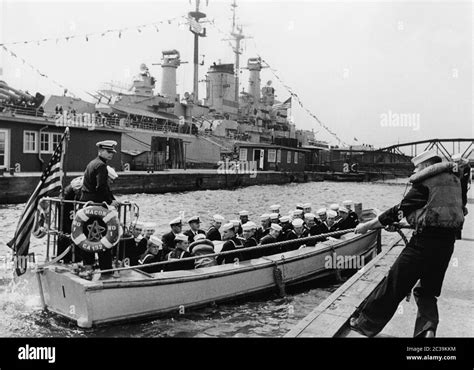 A Dinghy Of The Heavy Cruiser Uss Macon Ca 132 Seen In The Background