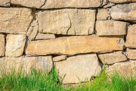 Stone Wall Behind a Grass Lawn Stock Image - Image of landscape, blue ...