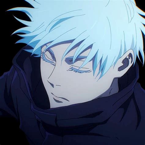 A Man With White Hair And Blue Eyes Stares Into The Distance While