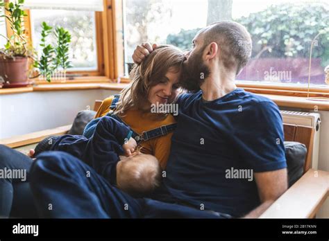 Woman Breastfeeding Husband