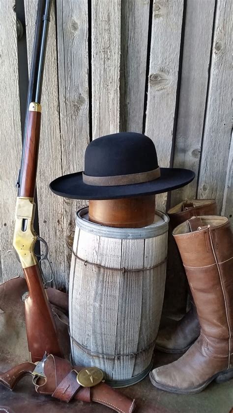 Black Boss of the Plains Hat with antique leather hat band and curled ...