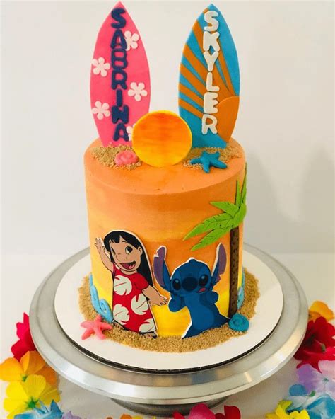 A Birthday Cake Decorated With Cartoon Characters And Surfboards