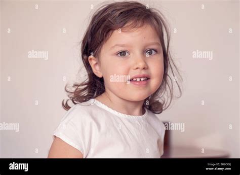 Close Up Portrait Of A Cute Little Girl Smiling Preschooler In A