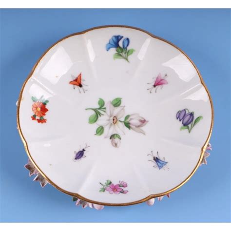 A 19th Century Meissen Flower Encrusted Cabinet Cup And Saucer