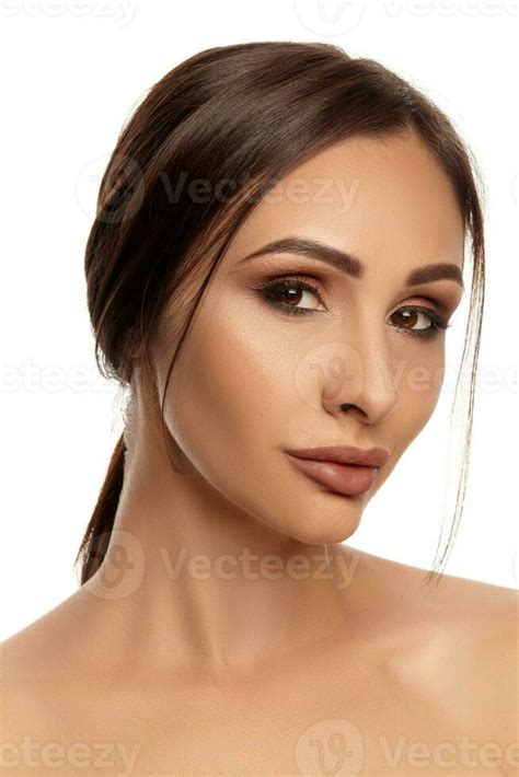 Close Up Portrait Of A Brunette Nude Model Girl With Professional Evening Make Up And Plump Lips