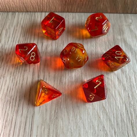 Chessex Gemini Translucent Red Yellow Gold Polyset Dungeons And Dice