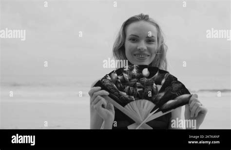 Sensual Glamour Woman In Black Bikini With Hand Fan On A Beach Stock Video Footage Alamy