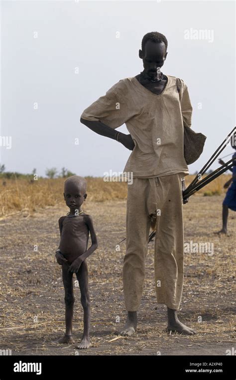 sudan impending famine malnourished man and child 1998 Stock Photo - Alamy