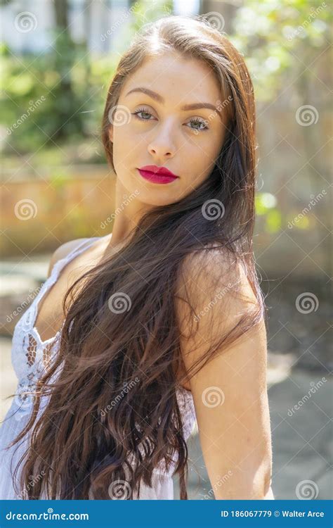 A Lovely Brunette Model Enjoys An Spring Day Outdoors Stock Image Image Of Green Feminine