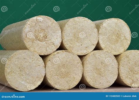 Wood Sawdust Briquettes Straightened, Green Background. Alternative ...