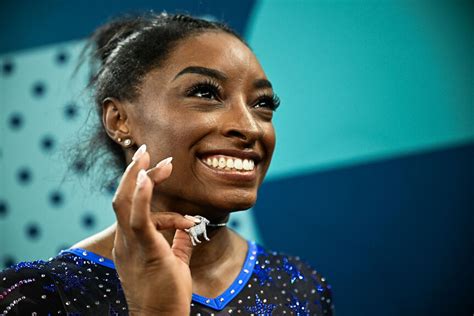 The Message Behind Simone Biles G O A T Necklace Photos Nbc Insider