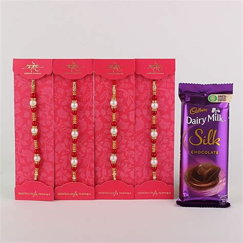 Buy Send 4 White N Red Pearl Rakhi With Silk Chocolate Mp Online FNP