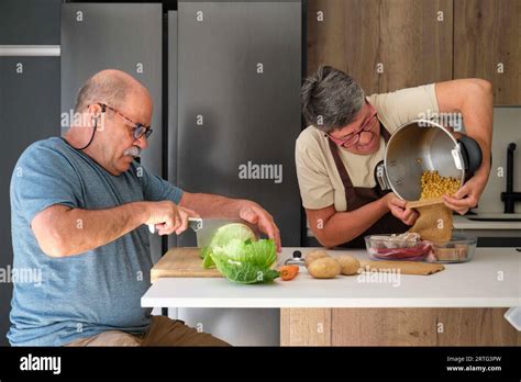 Mature Spanish Couple Cooking Cocido Typical Spanish Dish Stock Photo
