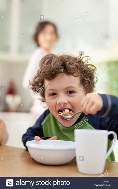 Young Boy Eating Cereal High Resolution Stock Photography And Images