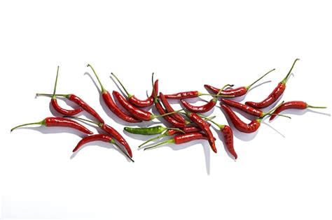 Premium Photo Hot Chili Peppers On Colorful Backgrounds