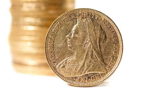 A Close Up Of A Coin With Stacks Of Coins In The Background