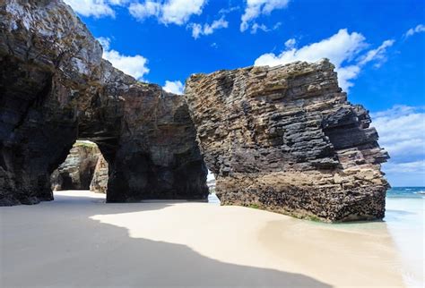 Premium Photo Natural Rock Arches On Cathedrals Beach In Low Tide