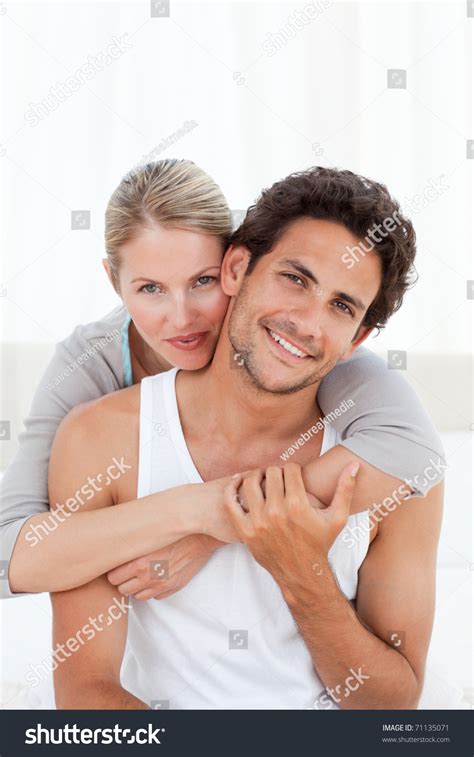 Lovely Couple Hugging On Their Bed At Home Stock Photo 71135071 ...