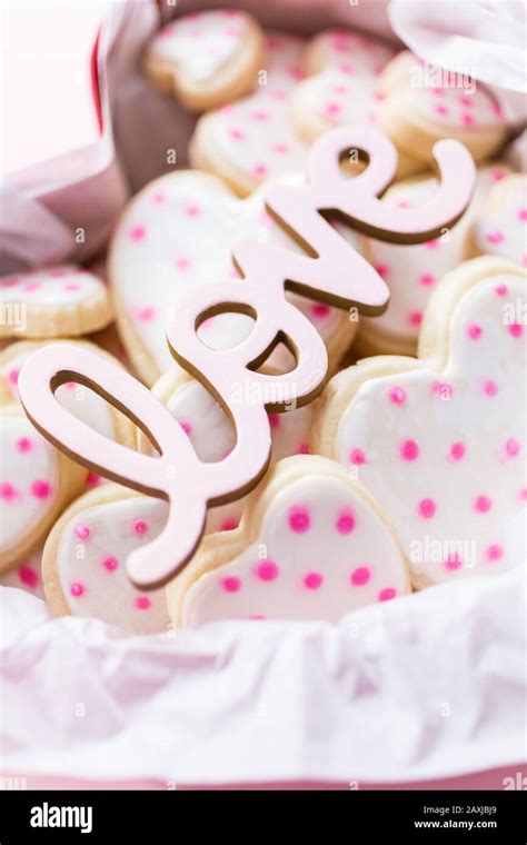 Heart Shaped Sugar Cookies Decorated With Royal Icing In Gift Box Stock