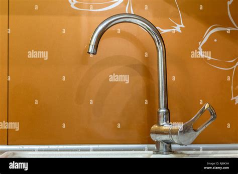 Water Tap Chrome Stainless Metal Faucet In Bathroom Or Kitchen Mixer Cold Hot Water Isolated