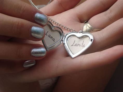 Two Heart Shaped Pendants With The Word Lanana Written On Them Are