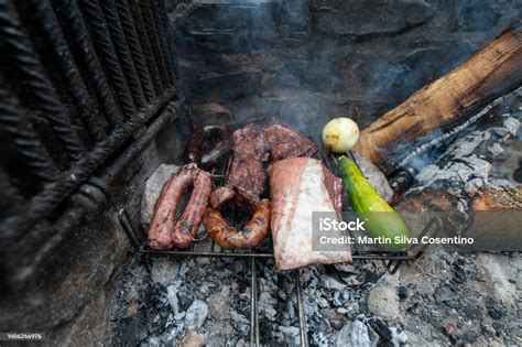 Typical Uruguayan And Argentine Asado Cooked On Fire Entrana And Vacio