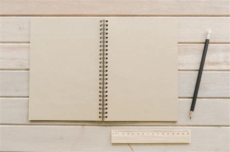 Premium Photo Directly Above Shot Of Spiral Notebook With Pencil And