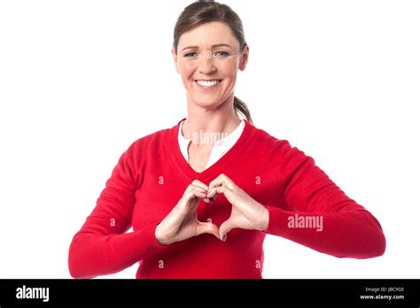 Middle Aged Woman Making Heart Symbol With Her Hands Stock Photo Alamy