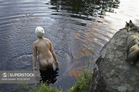 High angle view of a naked woman in a creek Hagbyån Kalmar SuperStock