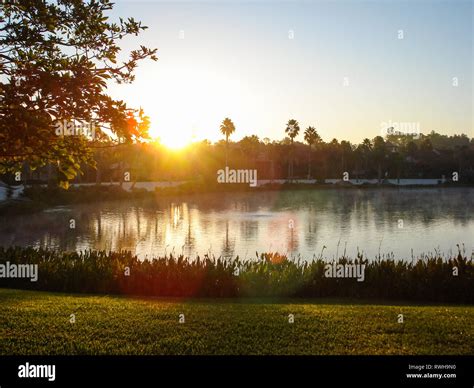 calm water sunset Stock Photo - Alamy