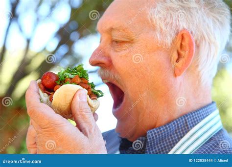 Outdoor Cook Eats Chili Dog Stock Photo Image Of Backyard Homemade