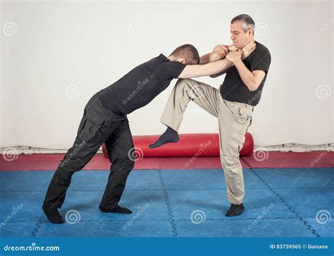 Street Fighting Self Defense Technique Against Holds And Grabs Stock