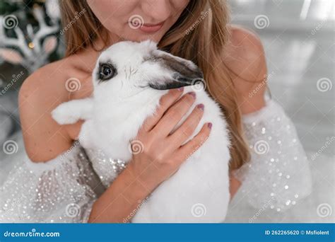 Woman Holding A White Rabbit Symbol Of The Year 2023 Close Up Of A