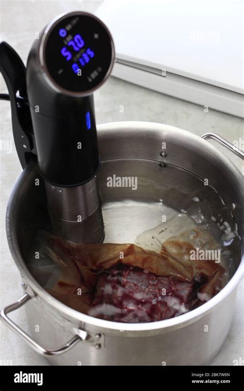 sous vide cooking, low temperature cooking Stock Photo - Alamy