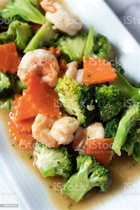 Broccoli And Carrot Sauteed Vegetables With Shrimp Stock Photo