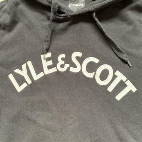 Lyle & Scott black hoodie with front pocket and... - Depop