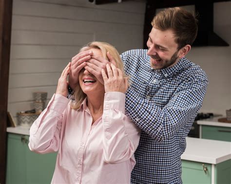 Free Photo Son Surprising Mom In The Kitchen