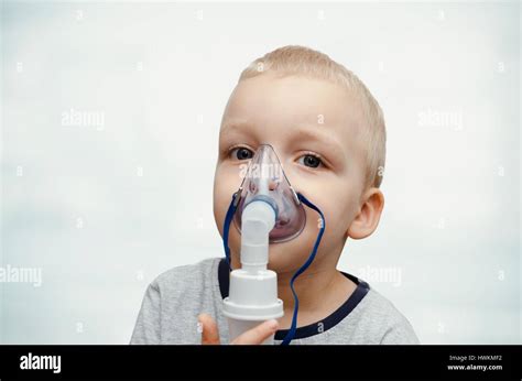 Child Making Inhalation With Mask On His Face Asthma Problems Concept