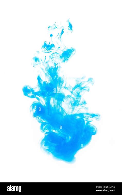 A Vertical Shot Of Of A Blue Ink Drop Into The Water Isolated On An