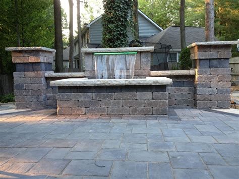 Beautiful Waterfall And Patio Using Unilock Brick Pavers Stonehenge