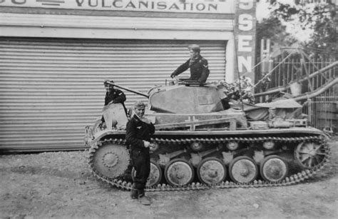 The Crew Of A German Panzer Ii Light Tank In A French Town With Their