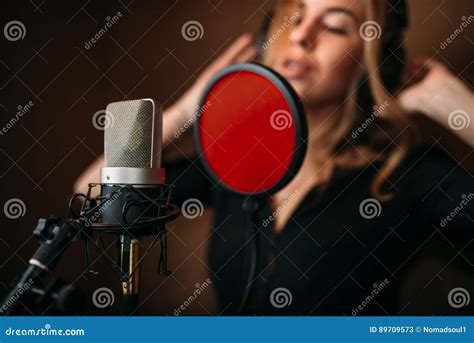 Female Singer In Headphones Against Microphone Stock Image Image Of