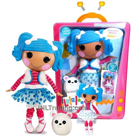 Two Dolls Are Shown In Front Of A Pink And Blue Box With White Polka Dots