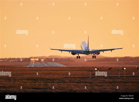 Airplane On Airport Runway Sunset Hi Res Stock Photography And Images