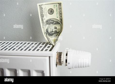 Heating Radiator With Dollar Bills Closeup Energy Crisis Concept Rising Costs In Private