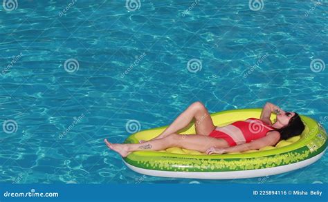 Summer Vacation Woman In Bikini On Inflatable Avocado Stock Footage